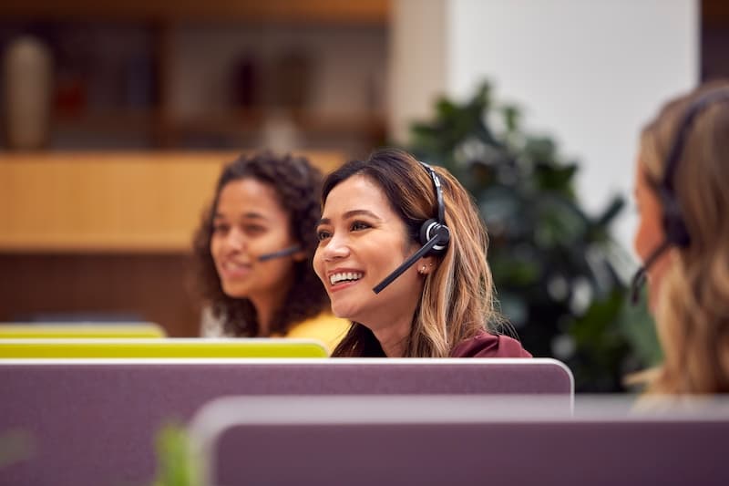 A view of two smiling female workers at a call centre
