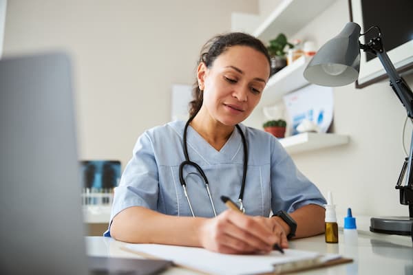 A doctor filling a prescription