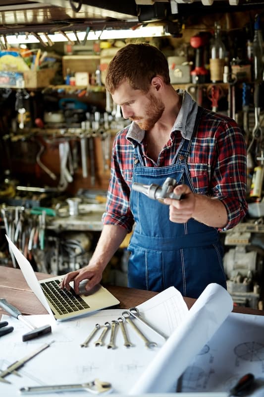 A mechanic cataloguing parts