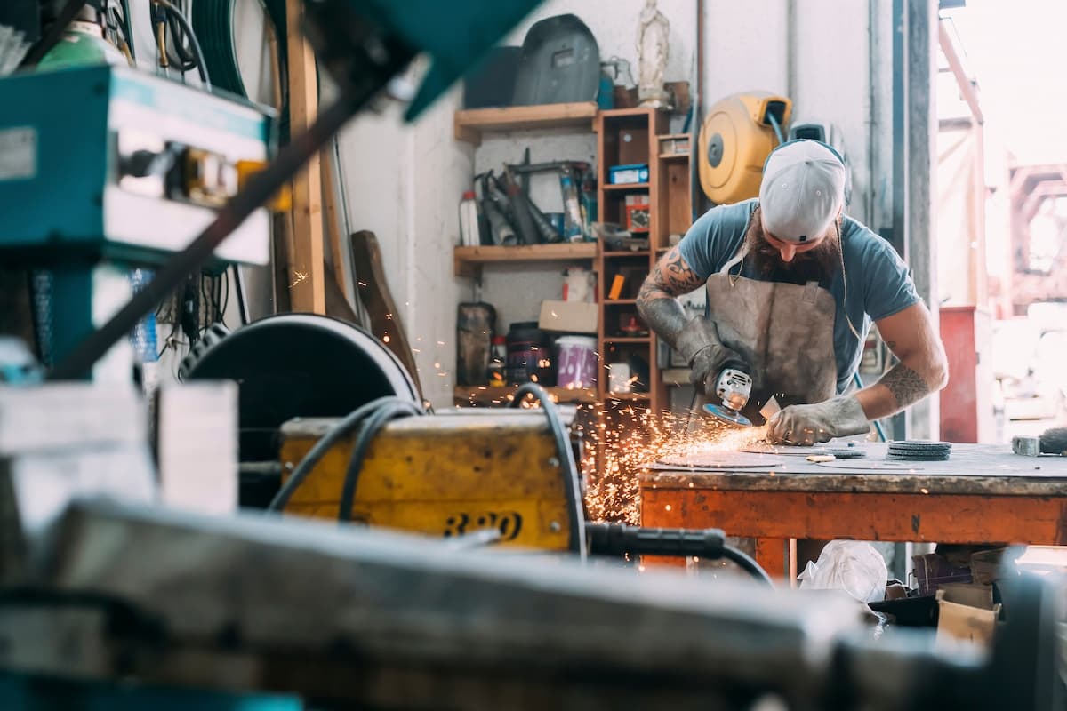 Steel grinder worker in a workshop