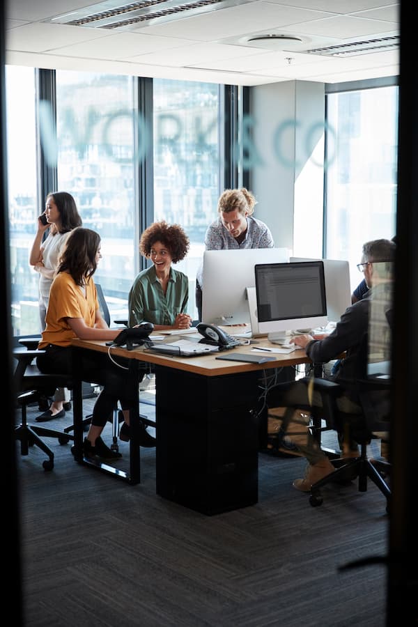 Admin and office support workers in modern office