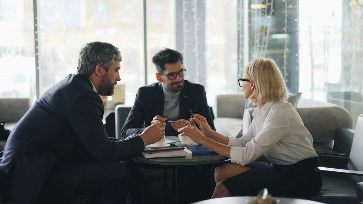 Business leaders discussing at a cafe